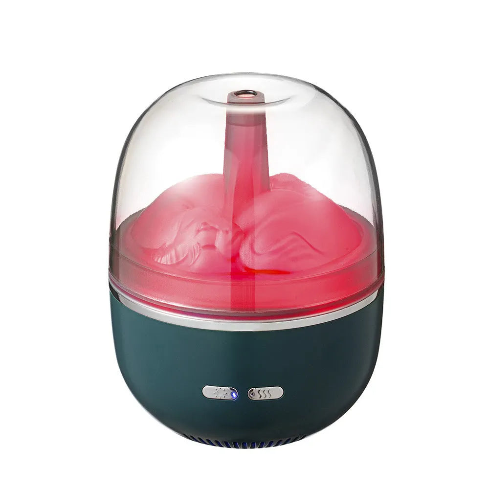 Green ultrasonic humidifier with colourful gradient light on desk showing heavy mist output