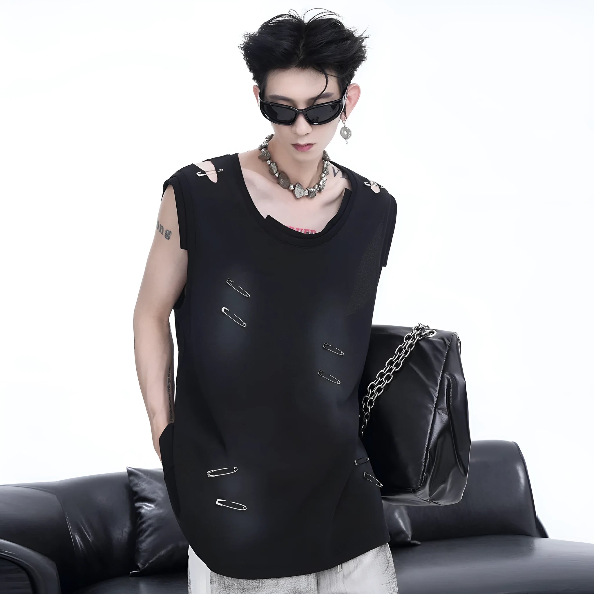 Men's black sleeveless vest waistcoat with irregular ripped cutting detail on a round neck collar.
