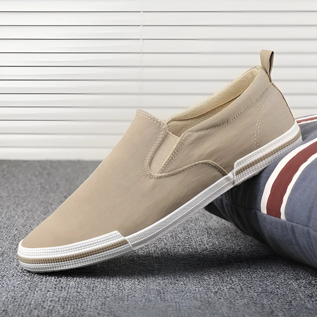 Men's low-top casual canvas shoes in grey, black orange, or khaki with vulcanised rubber soles.