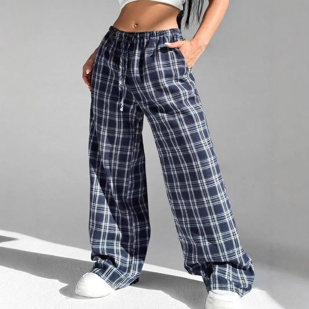 Women's loose plaid trousers with drawstring waist and front pockets in red or blue colours