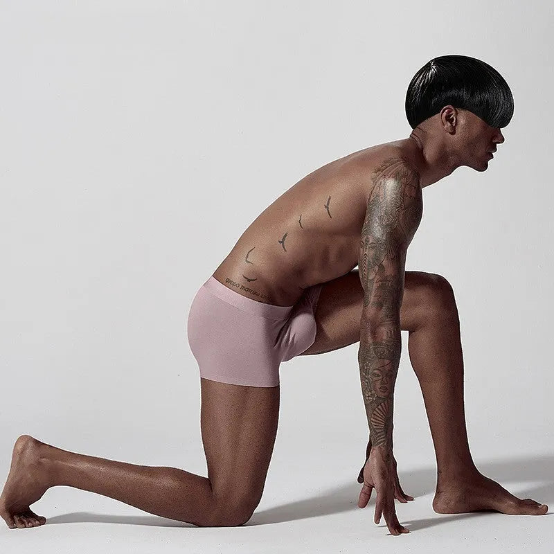 Men's seamless modal underwear in green showing mid-waist design and smooth construction