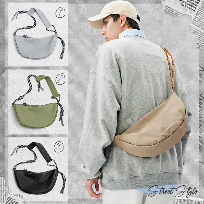 Men's lightweight nylon messenger bag in solid colour with large main compartment for daily use