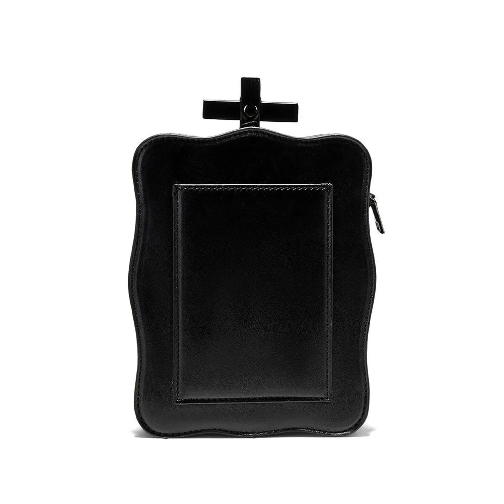 Black mini square crossbody bag with 3D embossed skull design, stitching, and chain detailing