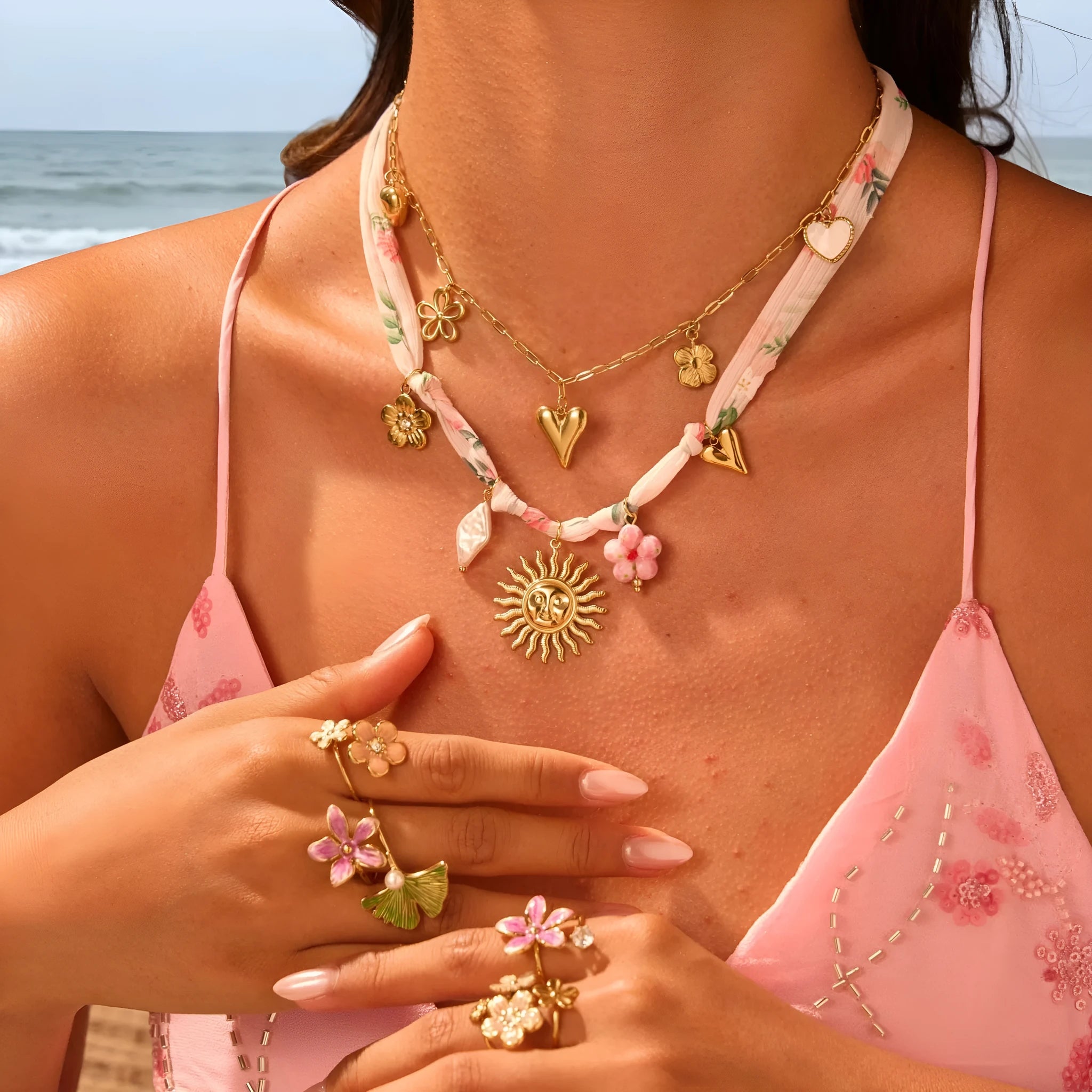 Stainless steel necklace with an 18K gold electroplated geometric pendant on an adjustable chain.