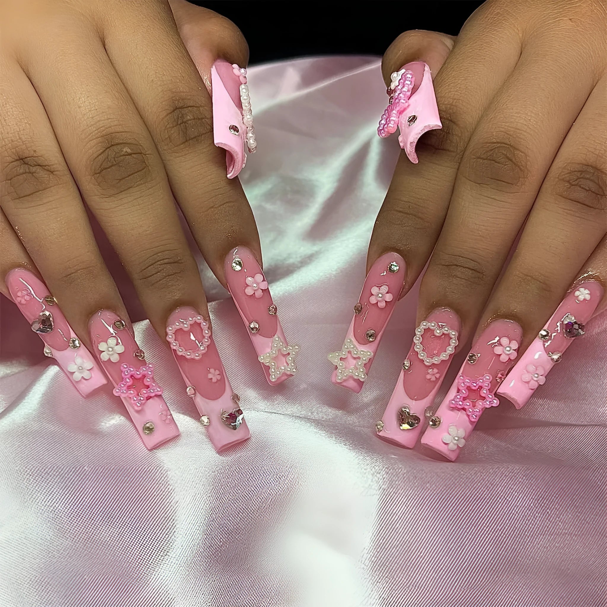 Super long false nails with French spot design, a bow, and a love pattern in colour XB-70-48.