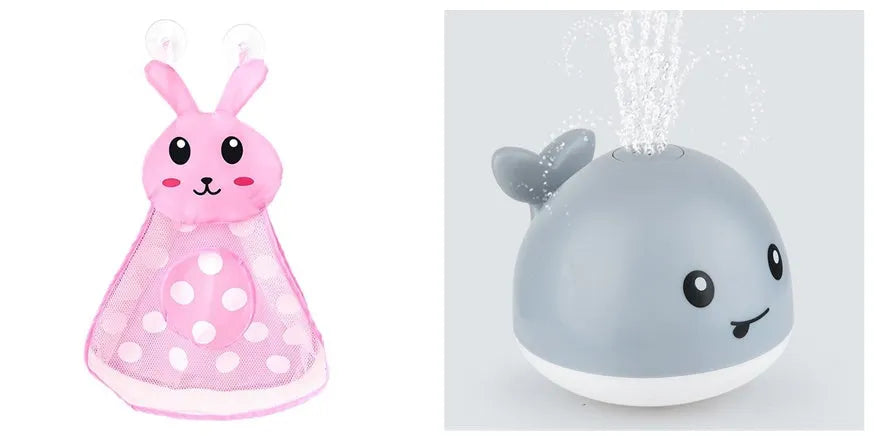 Automatic electric whale bath toy spraying water with LED lights on, floating in a baby bath.