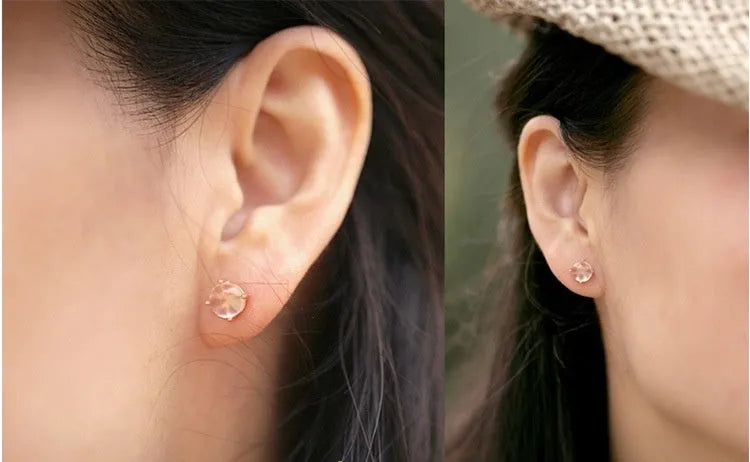 Women's rose gold plated stud earrings with a drop-shaped synthetic rose quartz stone.
