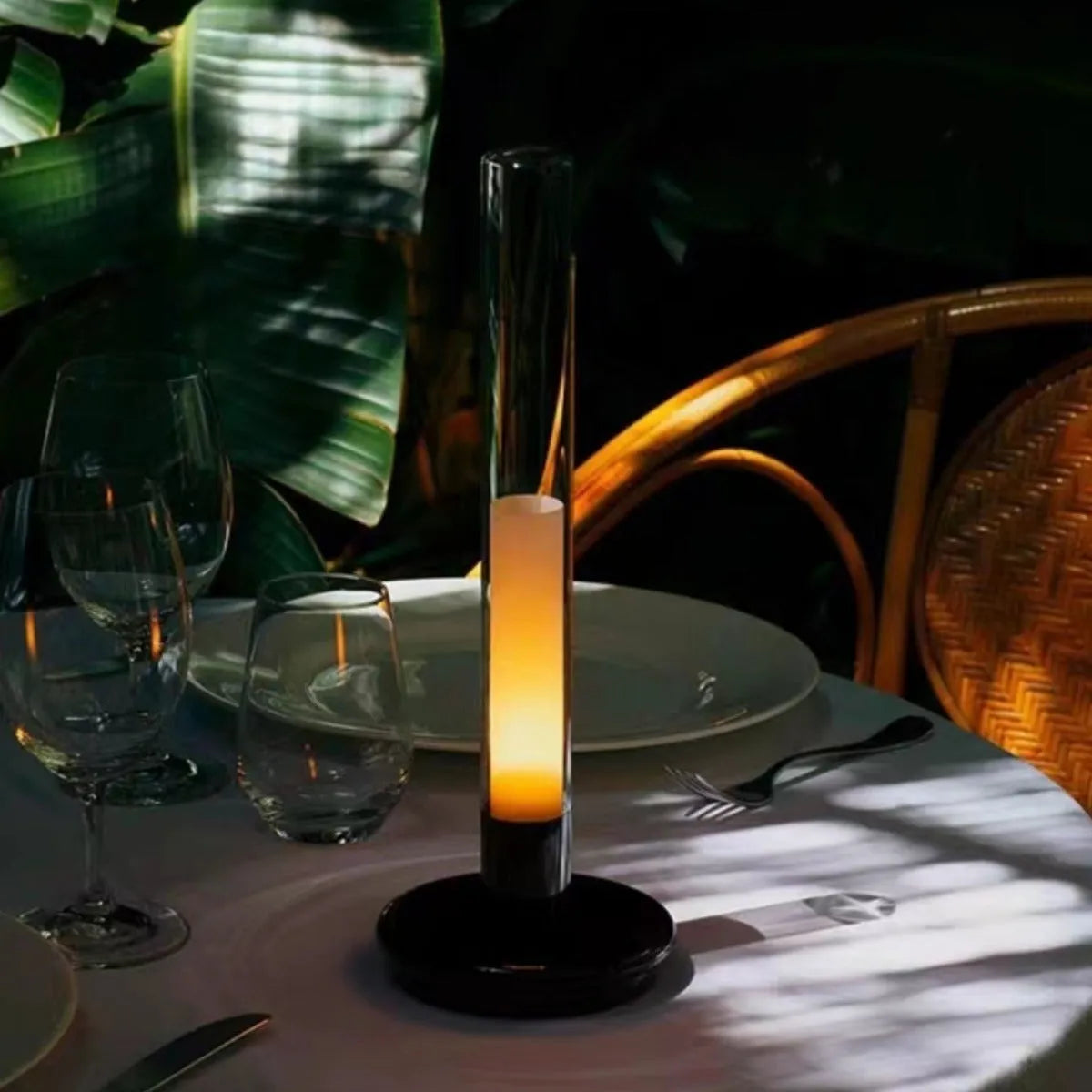 Black Nordic style LED table lamp with three-colour lighting modes on a desk
