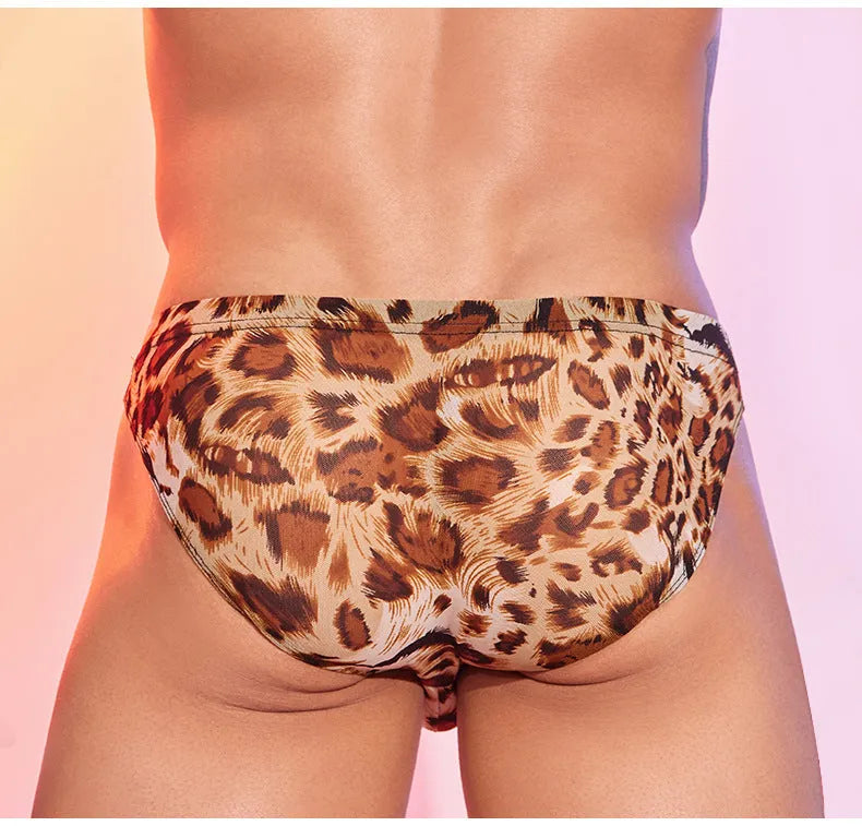 Men's low waist panties with a bold leopard print pattern on black nylon fabric.