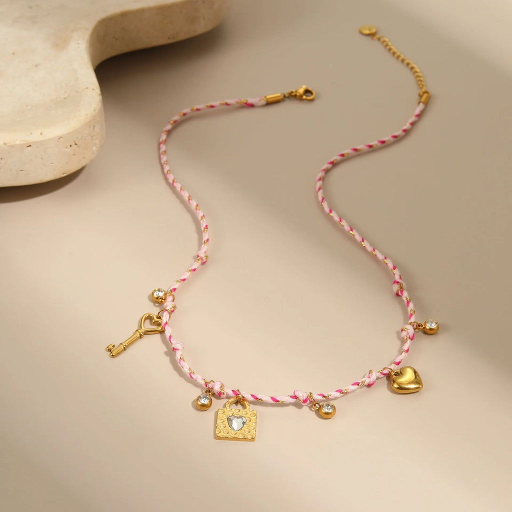 Handmade stainless steel necklace with coloured braided rope detail and geometric pendant