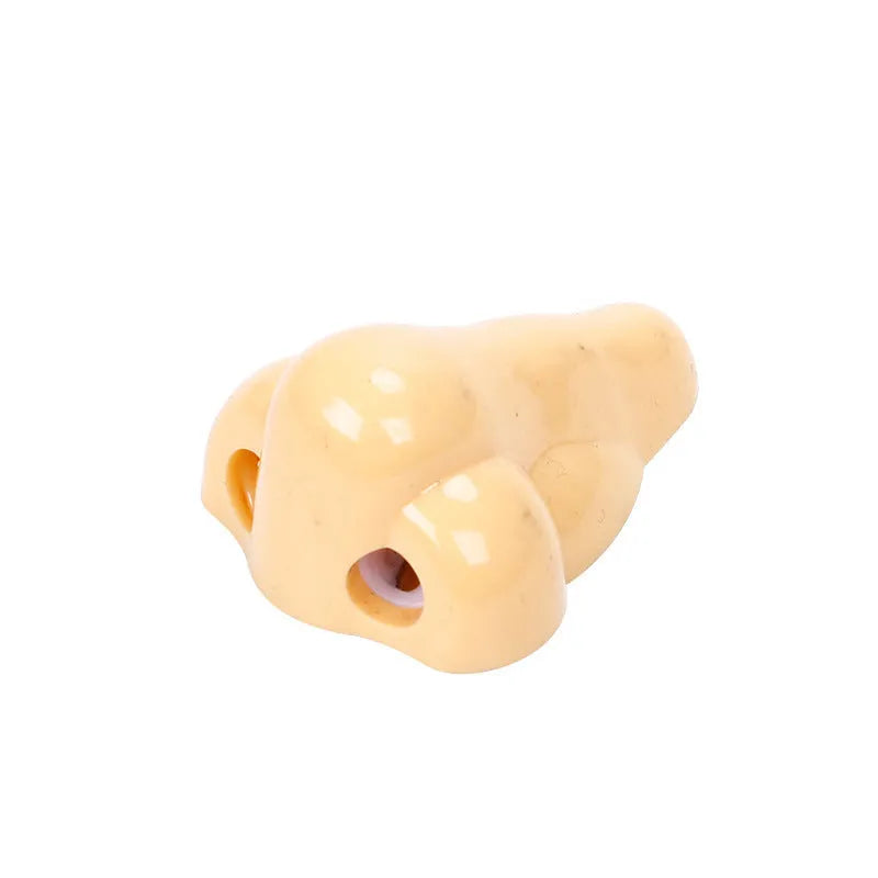 Plastic geometry-shaped manual pencil sharpener in flesh colour measuring 58x45x30mm