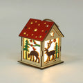 Decorative festive luminous wooden pendant with battery, showing snowman shape on a Christmas tree branch