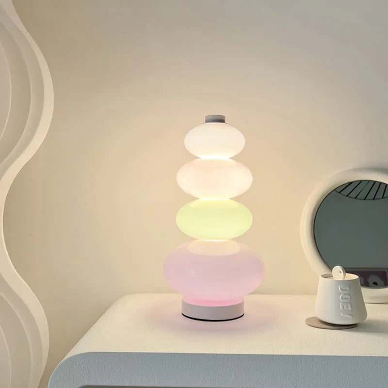 Candy String Rainbow Floor Lamp in creative macaron style with glass shade and iron body on a wooden table