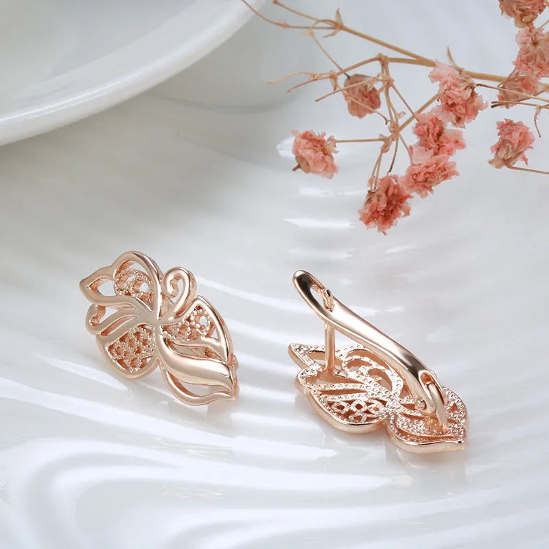 Rose gold copper earrings with hollow carved geometric design and rhinestone accents for women