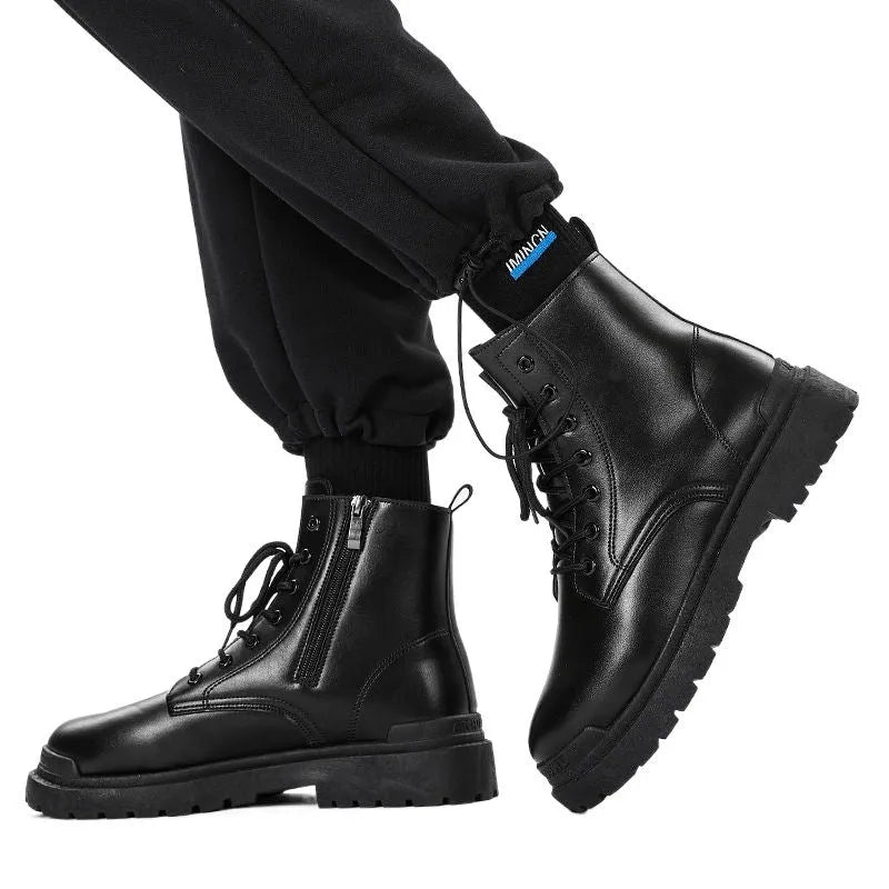 Men's black and brown mid-top leather boots with flat rubber soles.