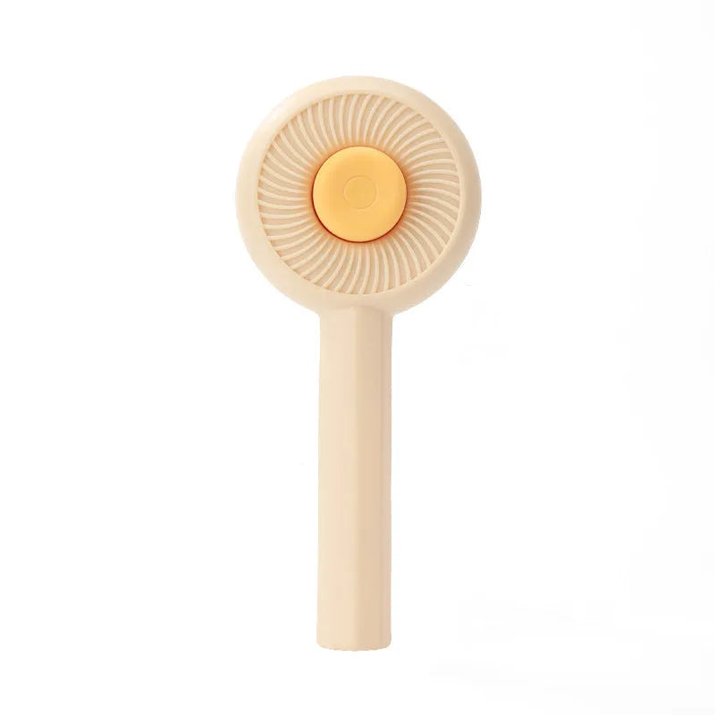 Blue and yellow pet grooming brush with angled bristles and self-cleaning button
