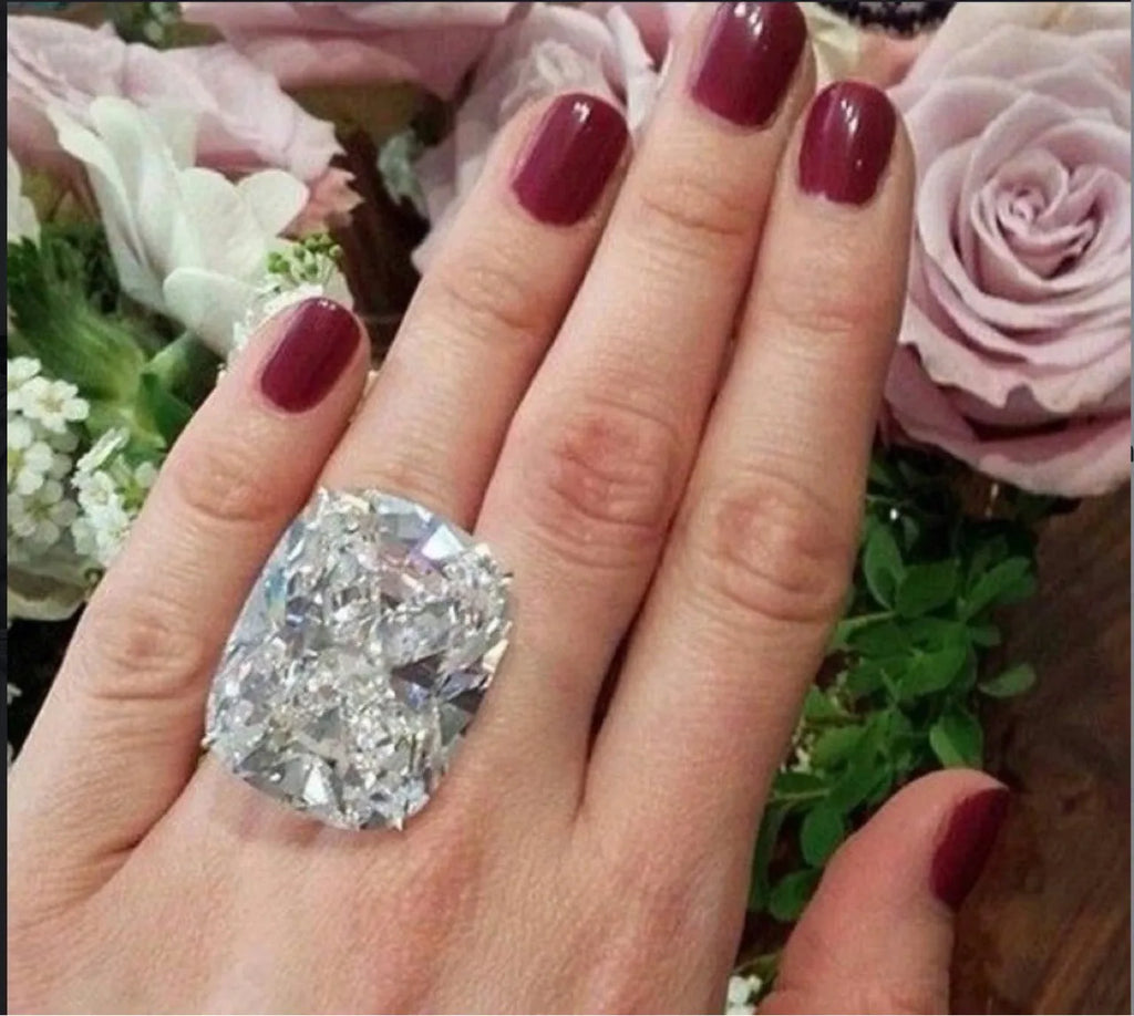 Women's white gold coloured square diamond ring with simple geometric design