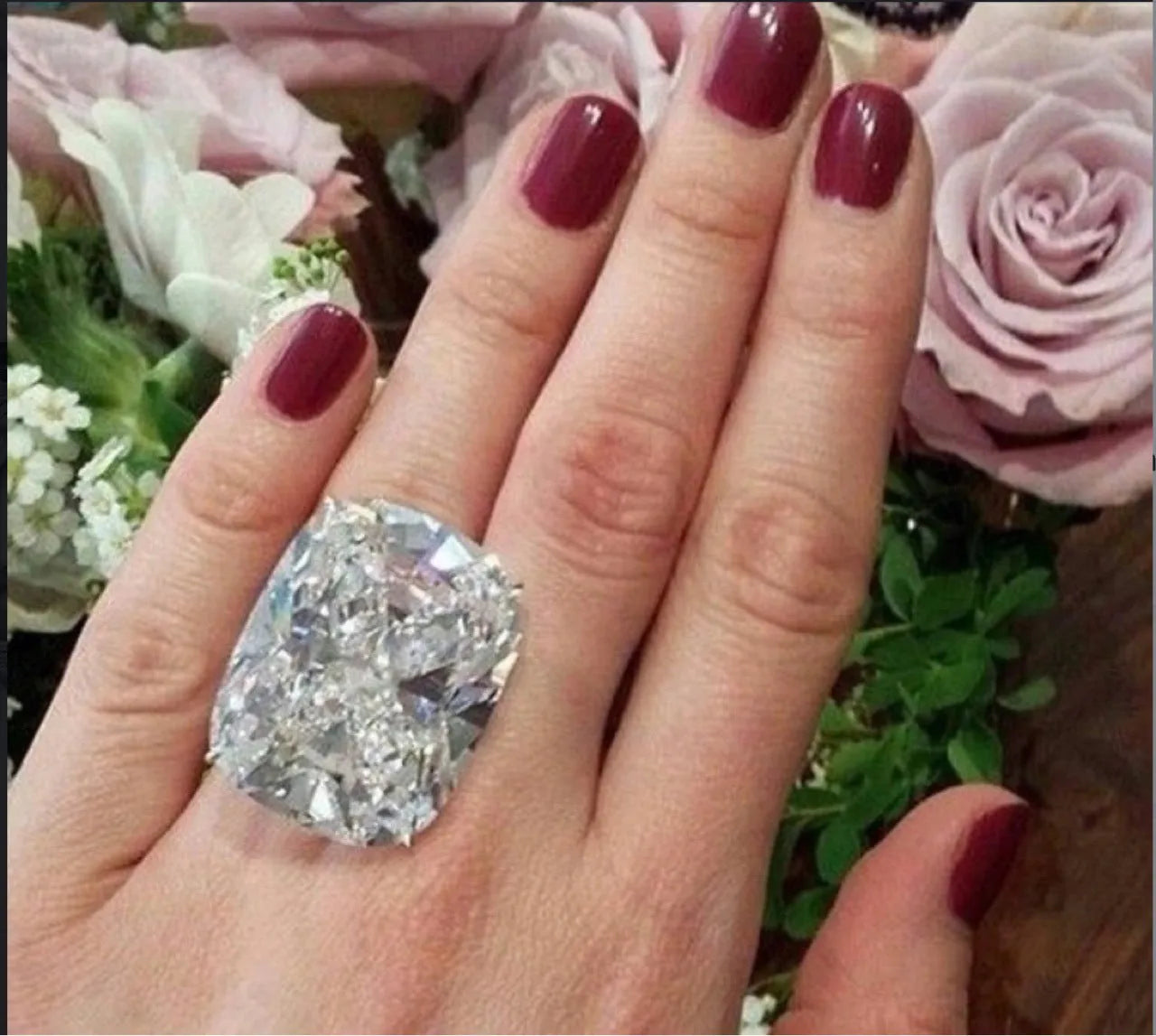 Women's white gold coloured square diamond ring with simple geometric design