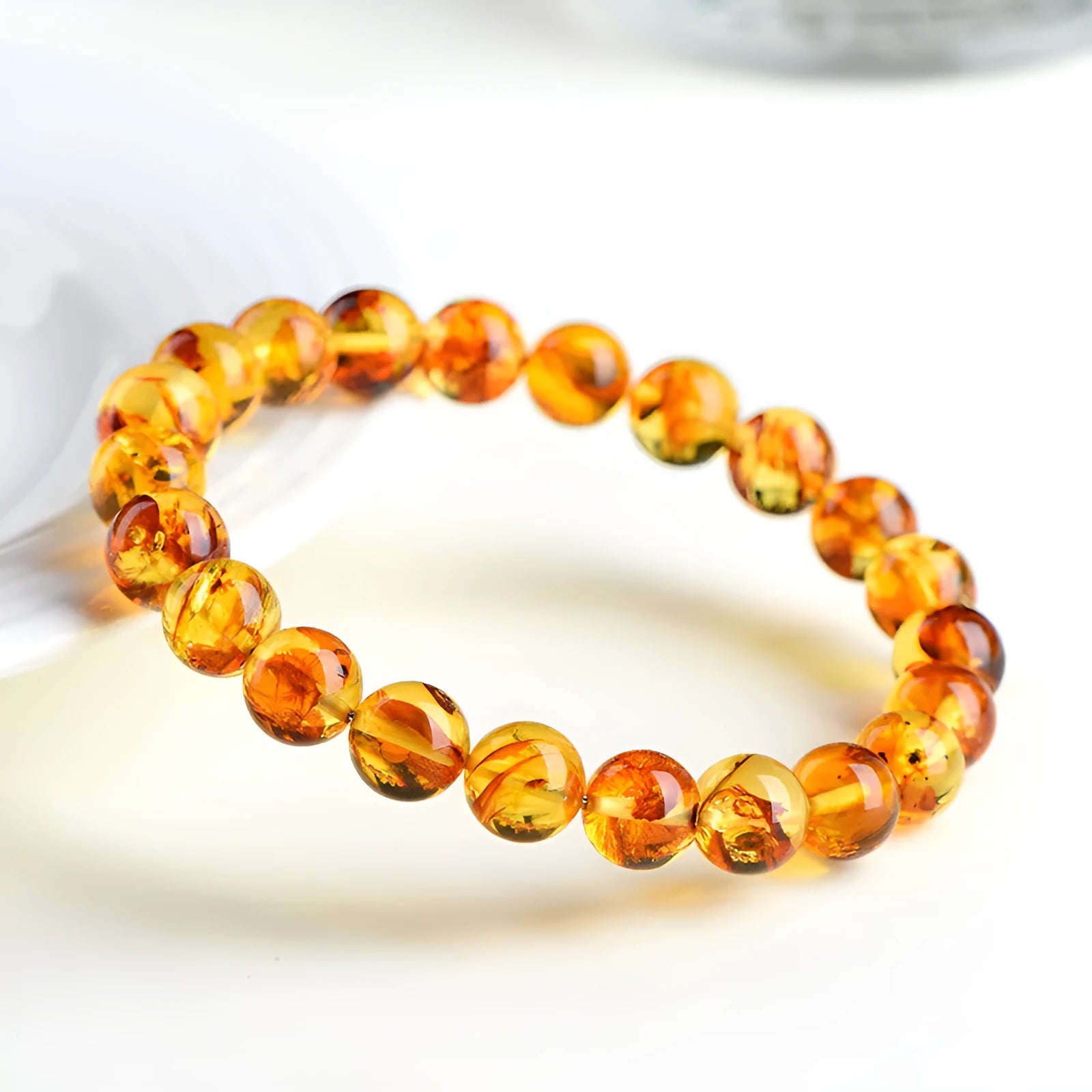 Natural yellow piebald amber bracelet with flower spot patterns and polished geometry beads