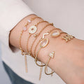 Gold zinc alloy bracelet set with six pieces showing arrow and water drop charms