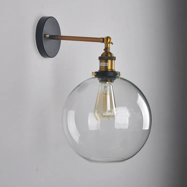 Round glass wall lamp with aluminium holder in transparent, amber, or smoky grey colour options