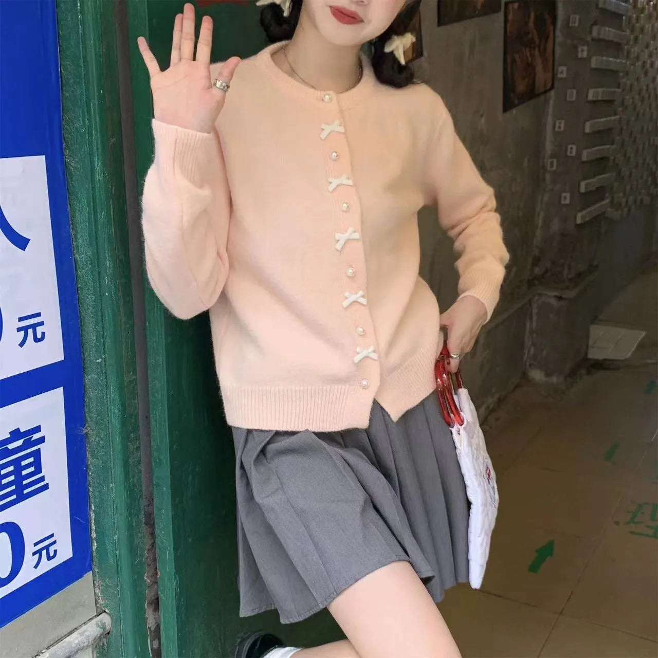 Women's pink cardigan with bow pearl buttons, regular sleeves, medium thickness