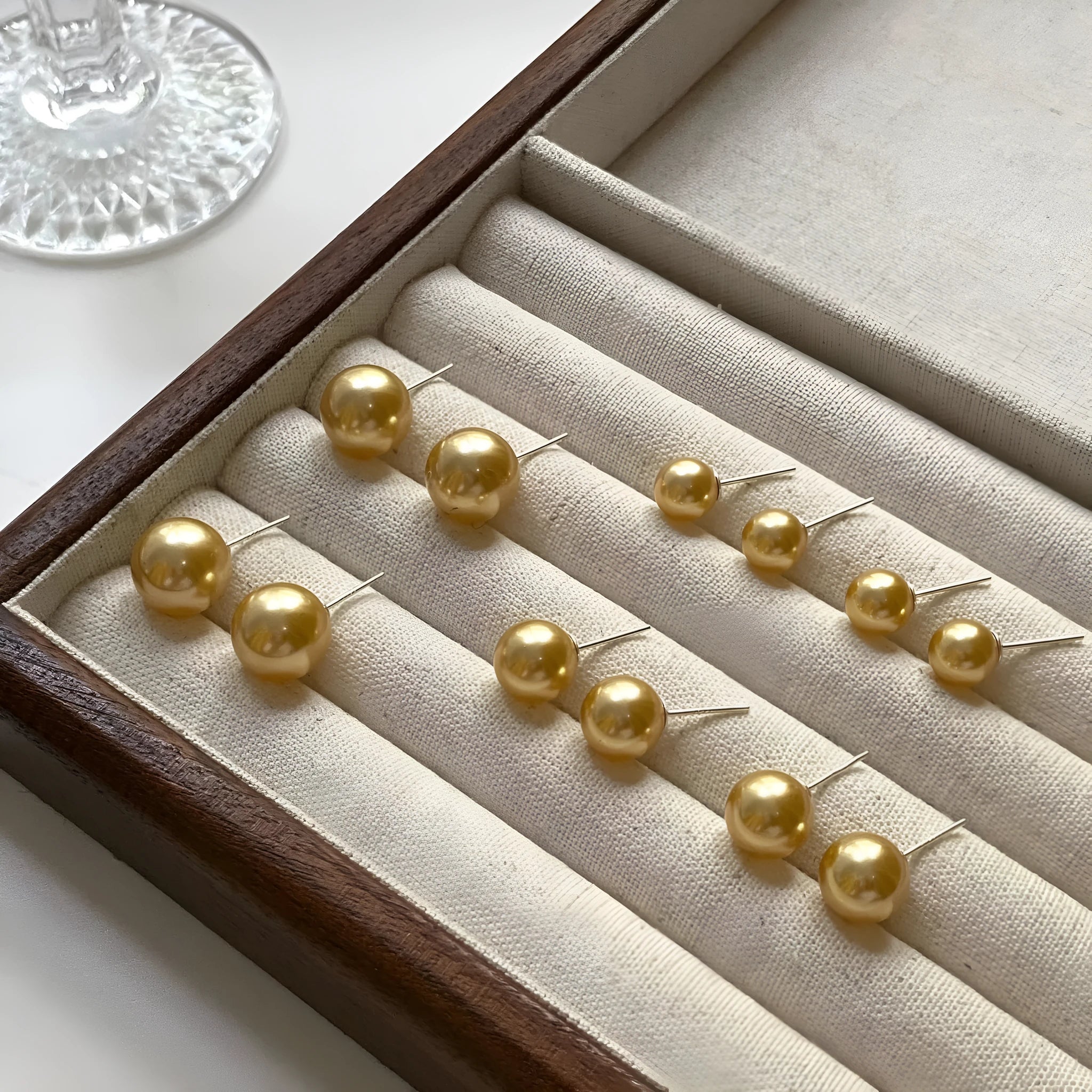 Retro-style geometric pearl stud earrings with star charms on silver settings