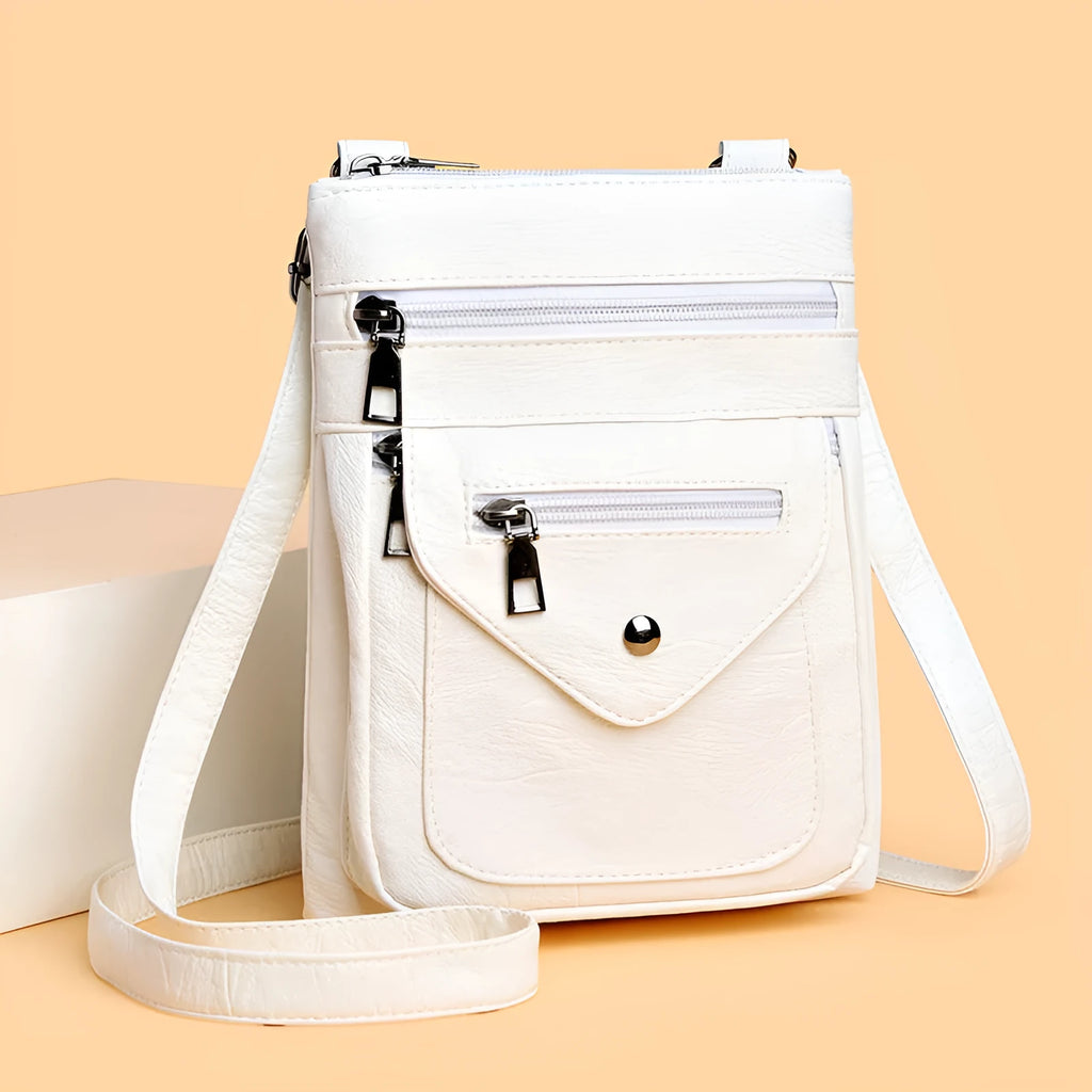 Vertical crossbody mobile phone bag in square shape with sewing line details
