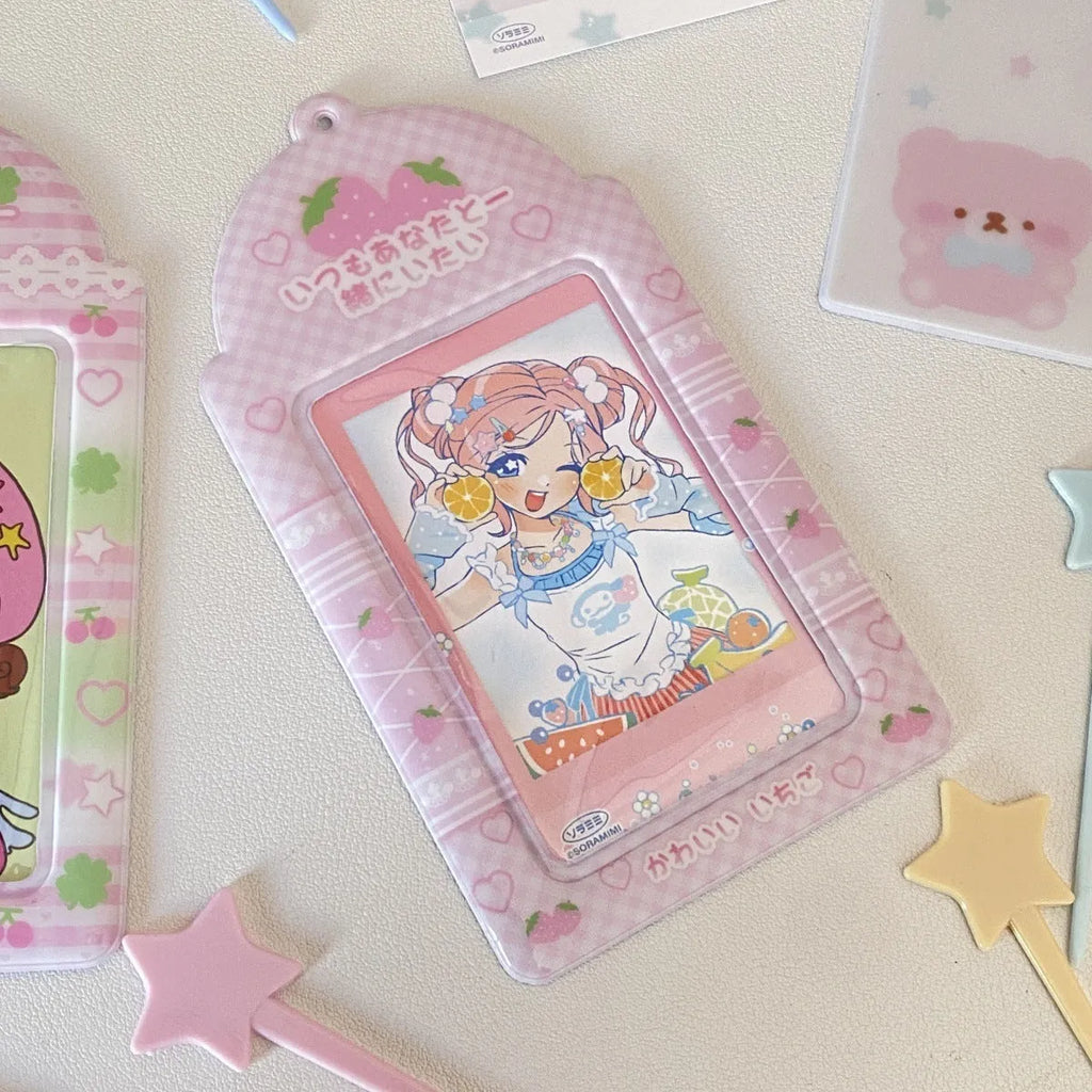 Cartoon PVC meal card holder pendant on a chain, showing strawberry and four-leaf clover design options.