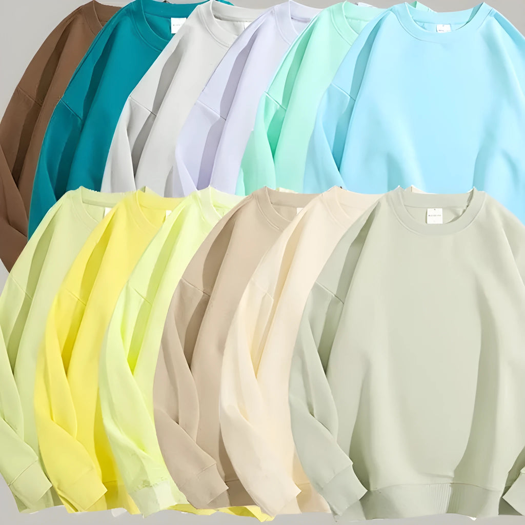 Loose-fitting, cotton, off-shoulder knit sweater in a solid colour on a hanger.
