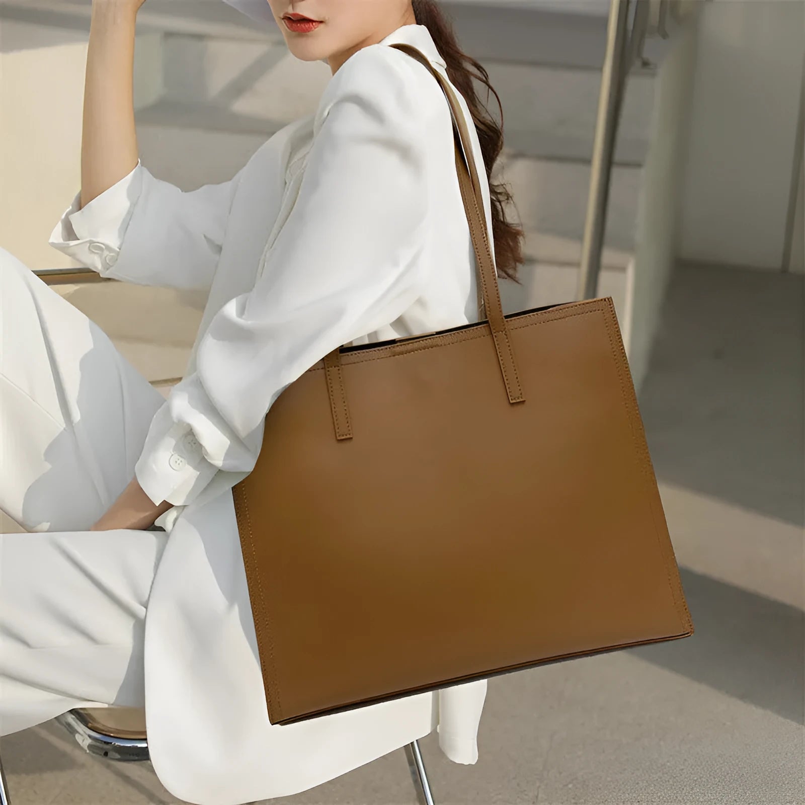 Brown genuine leather women's one shoulder handbag with a horizontal square shape.
