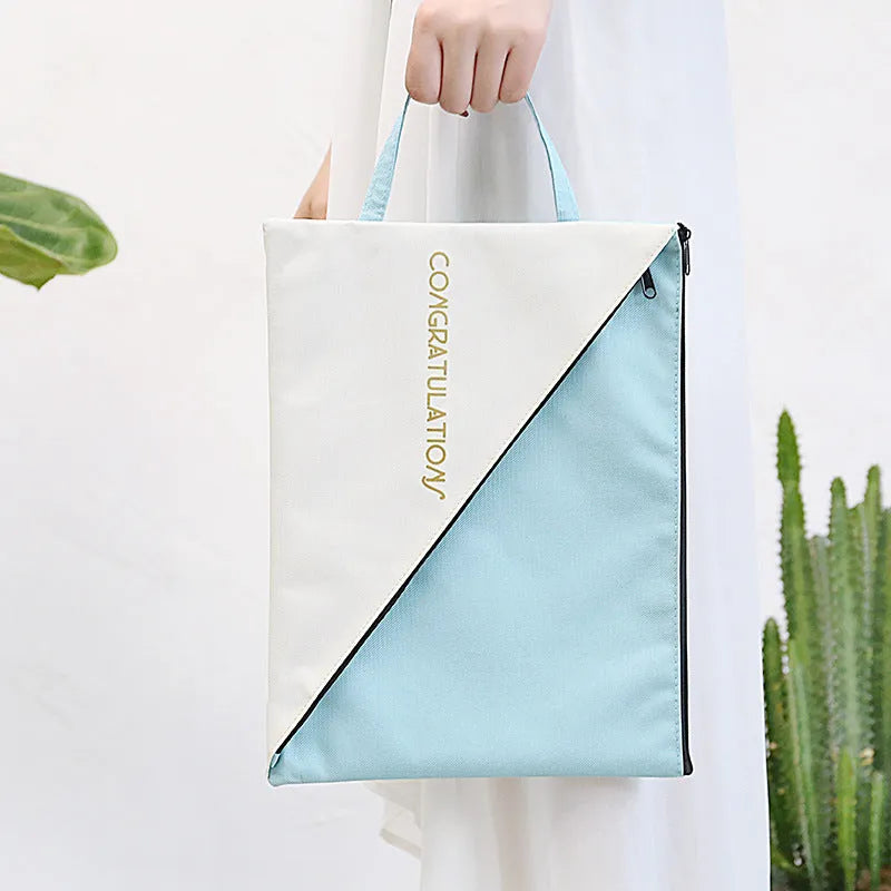 Blue Oxford cloth document storage bag with zipper closure showing A4 paper size