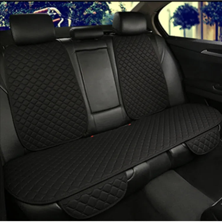 Linen universal car seat cushion with backrest in warm cream colour on a car seat.