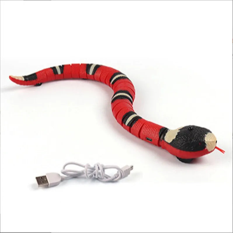 Interactive electric induction snake cat toy with S-shaped body, flashing eyes, and retractable tongue on a floor