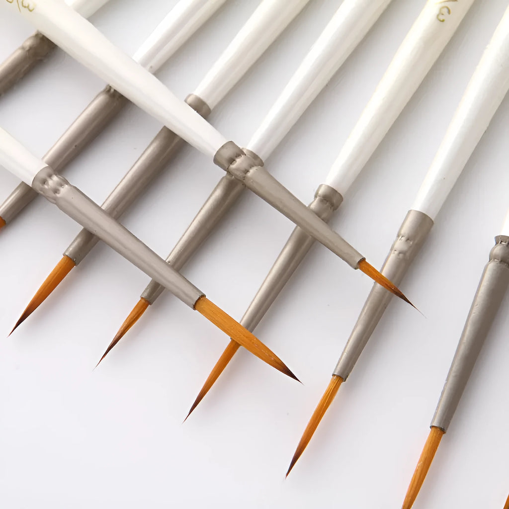 A 12-piece set of Pearl White artist brushes with a solid wood pen holder.