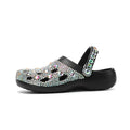 Black platform sandals for women with a rhinestone hole design and EVA construction.