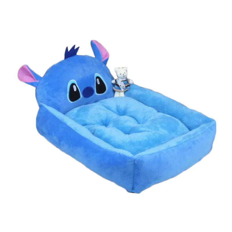 A blue cartoon-style pet sofa bed with raised sides for a small dog, showcasing its washable cover and non-slip base.