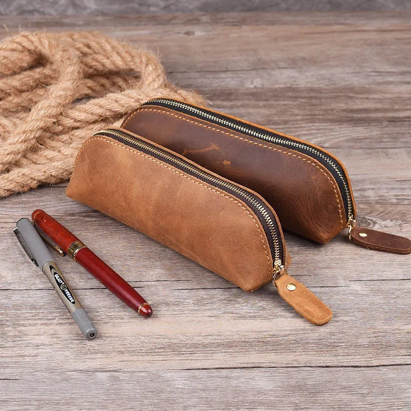 Black genuine leather pencil case with zipper closure measuring 18cm