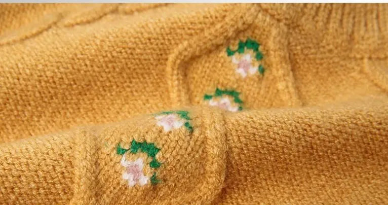 Girls pink knitted diamond flower pullover sweater with rabbit fur composition on white background