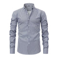 Man wearing a striped long sleeve business shirt with a lapel collar in a blue colour variant.
