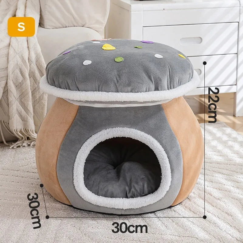 Grey mushroom-shaped plush cat bed on a wooden floor