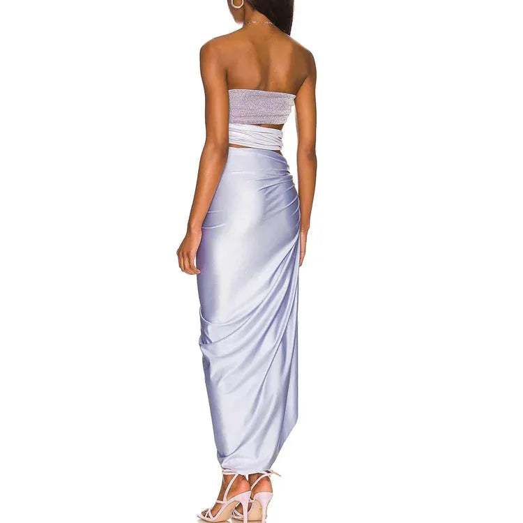 Purple women's one-piece swimsuit with hollow design and matching wrap skirt on mannequin