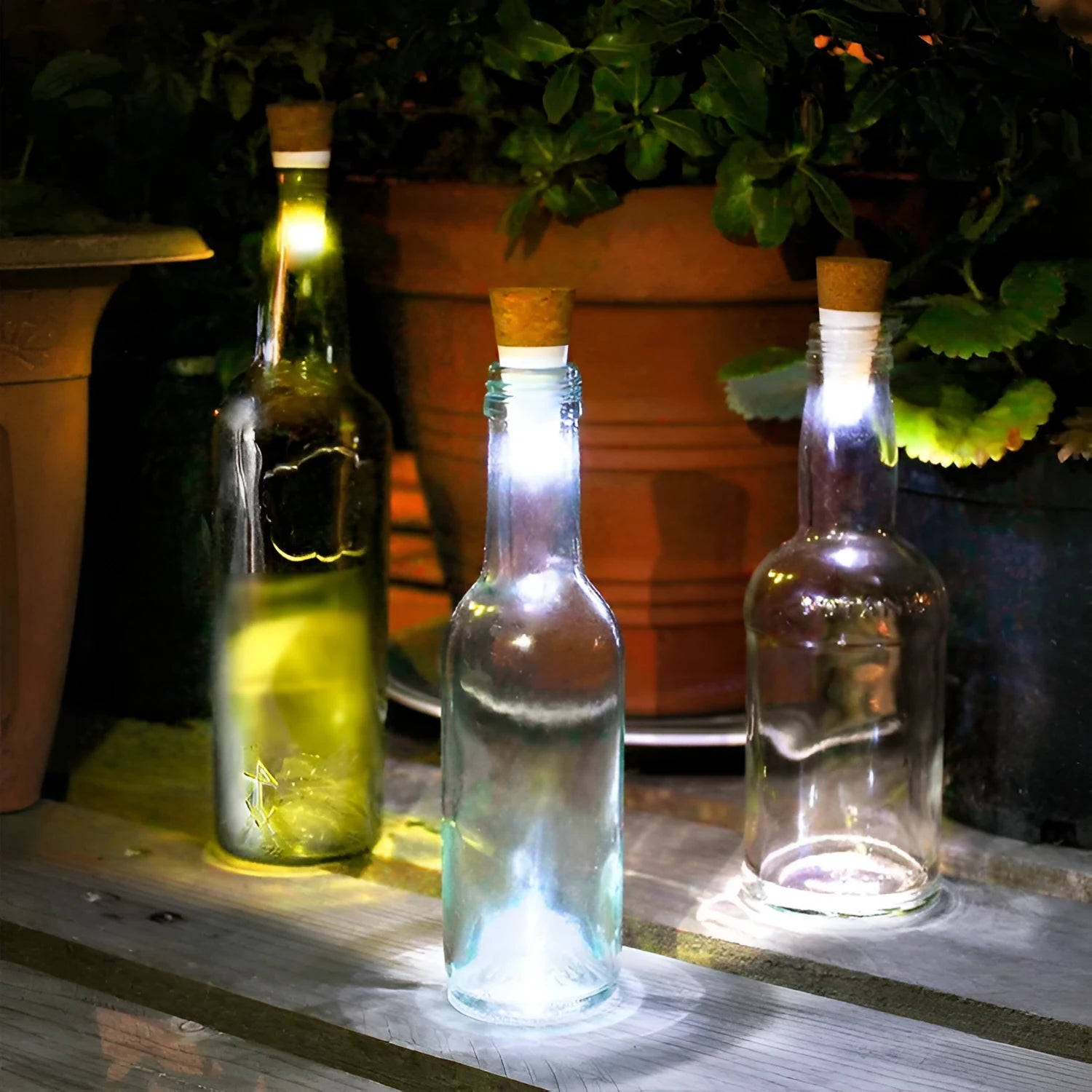 White plastic rechargeable LED cork light for bottle decoration, showing 15 LED beads.