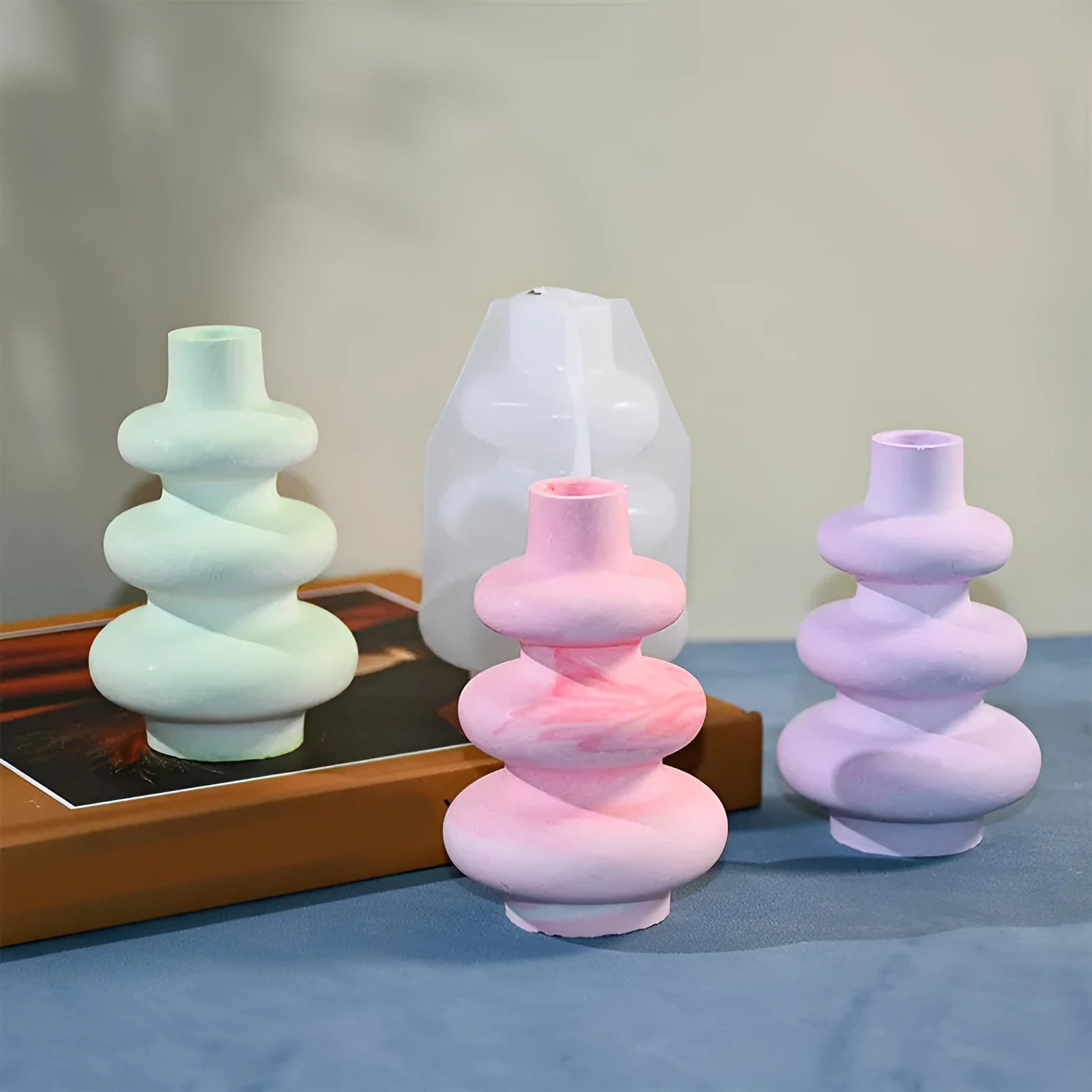 Silicone mould for making three-layer circular vase ornament cakes in modern irregular shape.