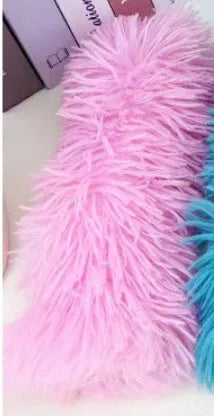 Plush cat toy pillow in green, white, blue, and pink colours measuring 27cm by 10cm