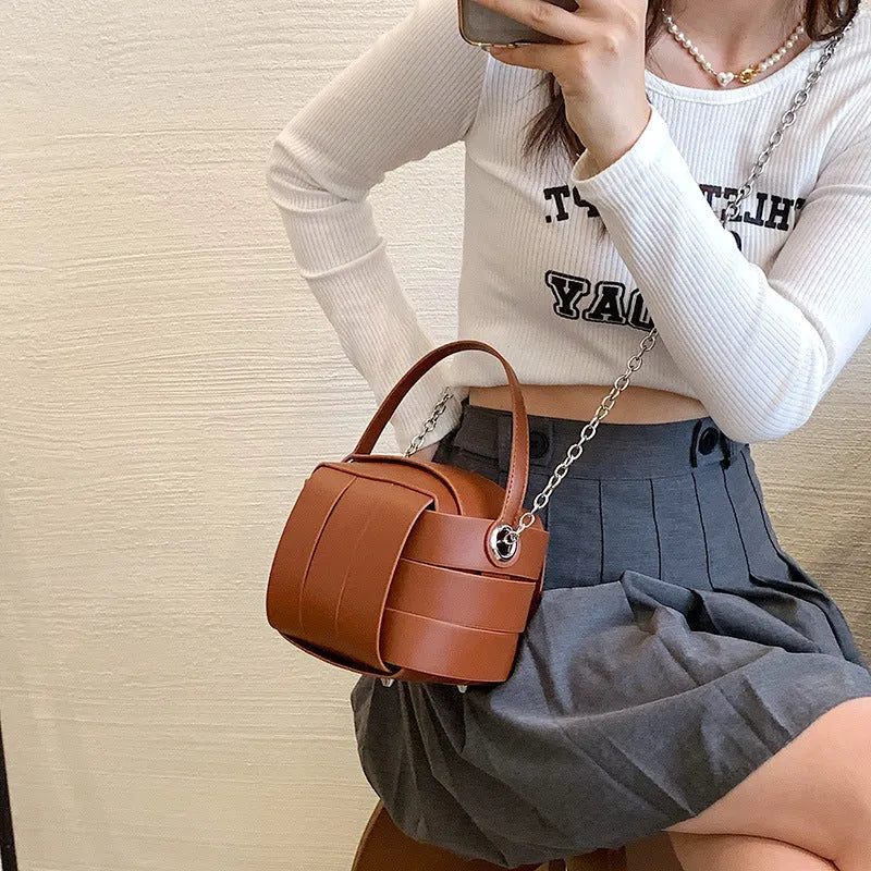 Women's PU leather vintage spliced crossbody handbag in black with magnetic buckle closure, 14cm size