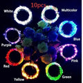 Silver copper wire LED string light with bottle stopper for decorative lighting.