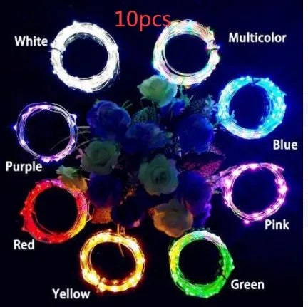 Silver copper wire LED string light with bottle stopper for decorative lighting.
