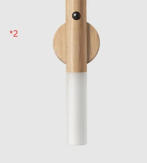 Smart motion sensor LED desk lamp made of solid wood and acrylic with a rechargeable battery.