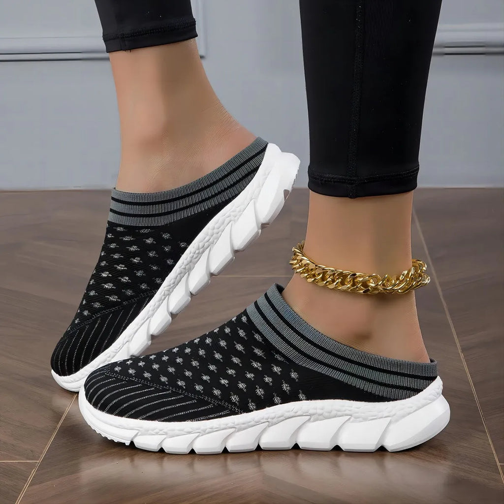 Women's black striped Flyknit slipper shoes with a height-increasing sole on a plain background